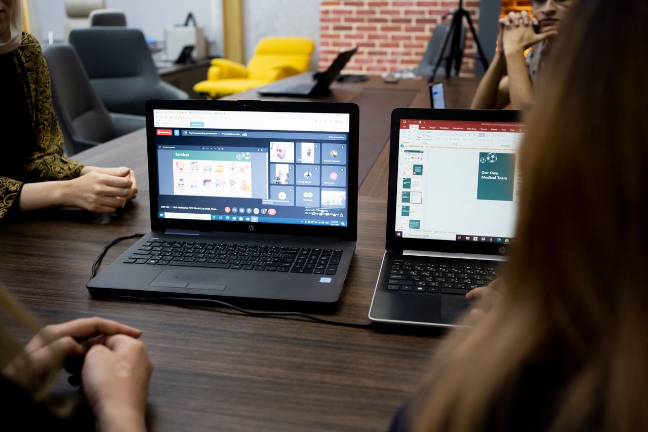 Home Team discusses projects during a virtual and in-person meeting in a Dubai office.